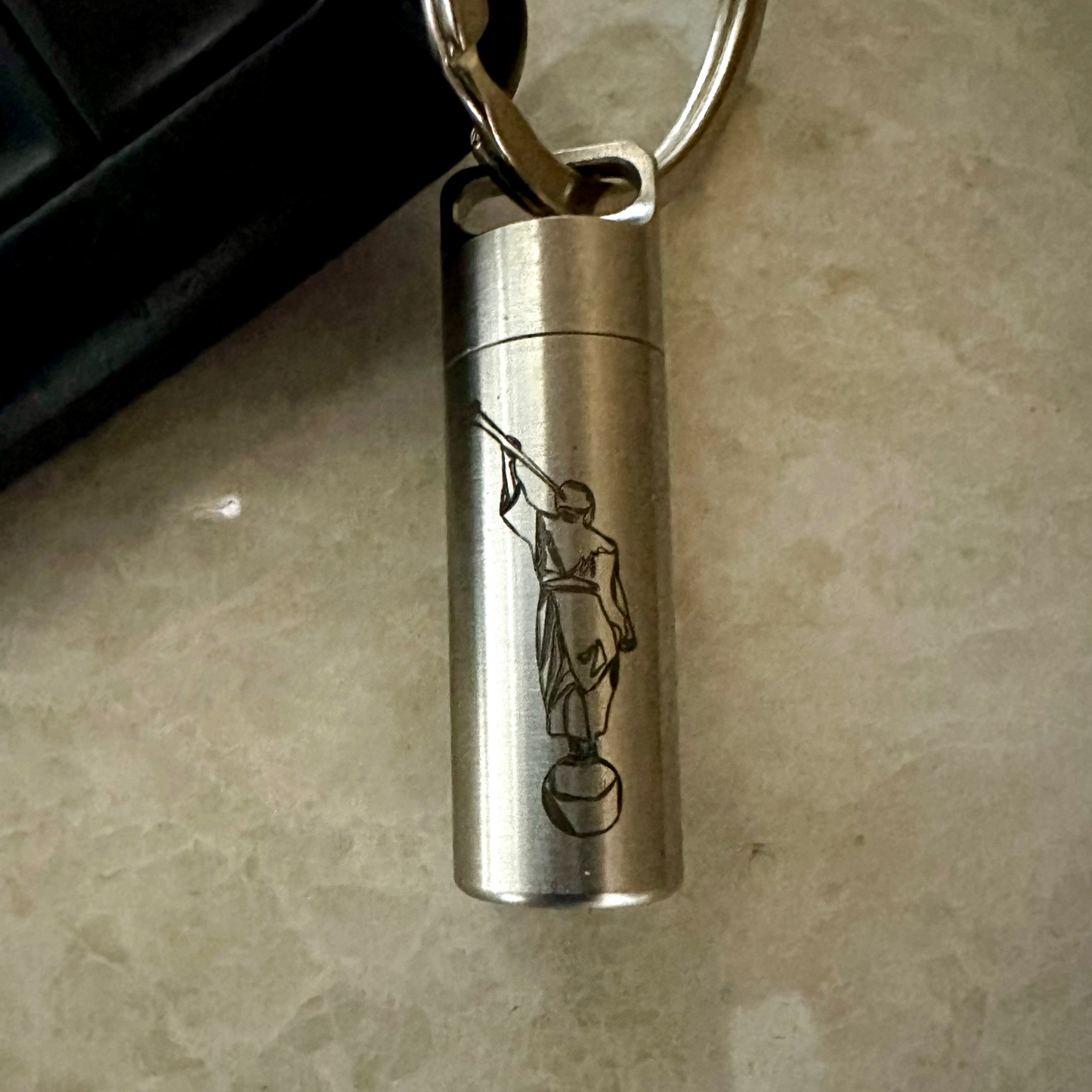 consecrated oil vial made of stainless steel with a secure screw cap, featuring an elegant engraved design, ideal for Latter-day Saint priesthood blessings
