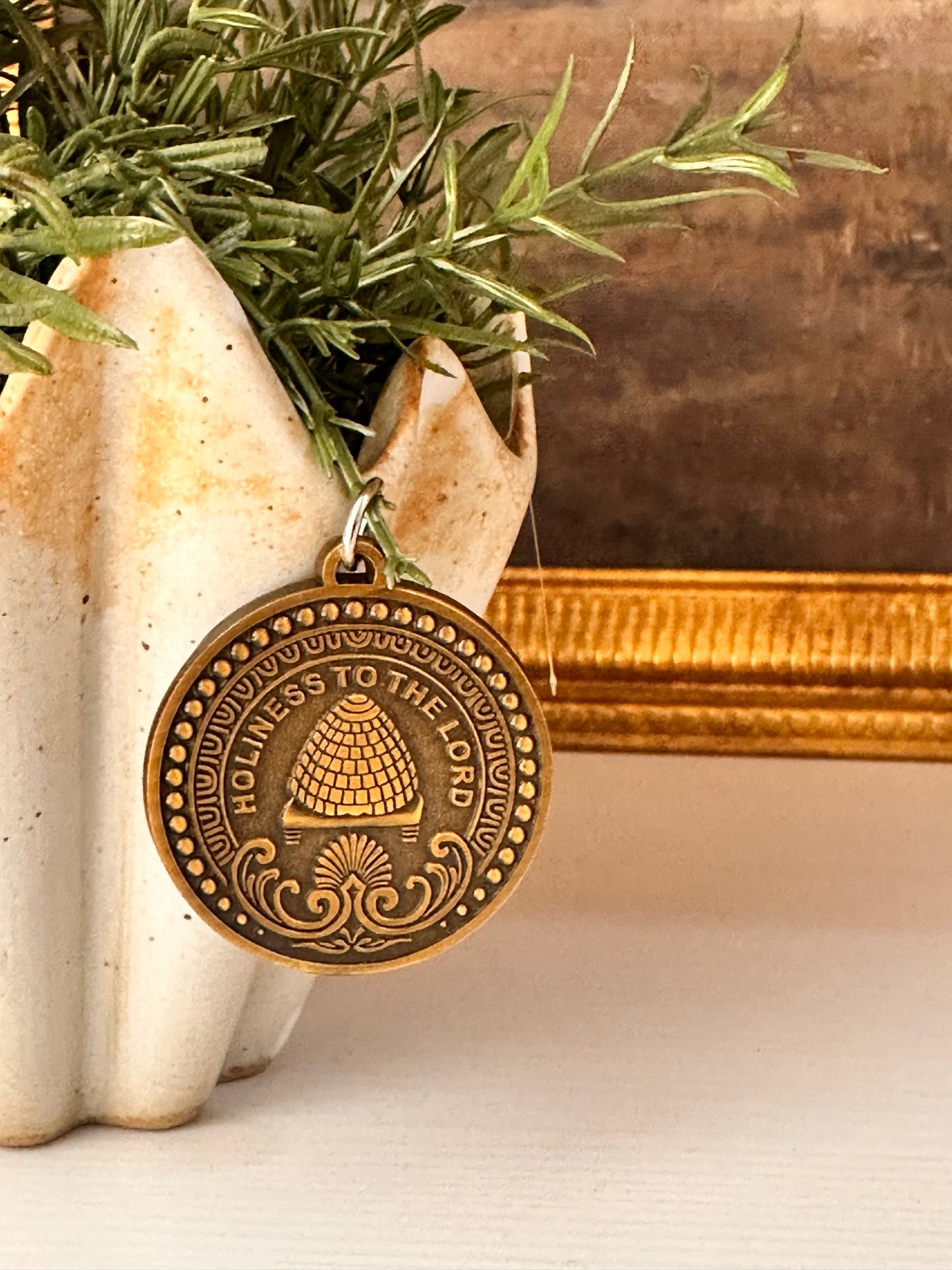 antique brass medallion with LDS Temple Inspired engraving. Holiness to the Lord.