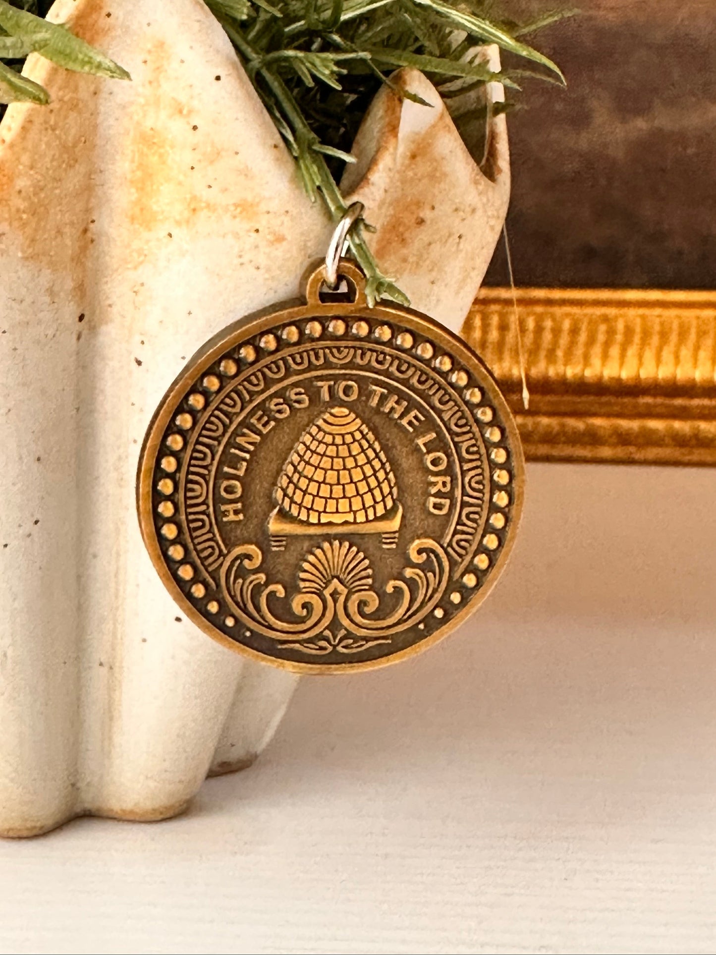 antique brass medallion with LDS Temple Inspired engraving. Holiness to the Lord.