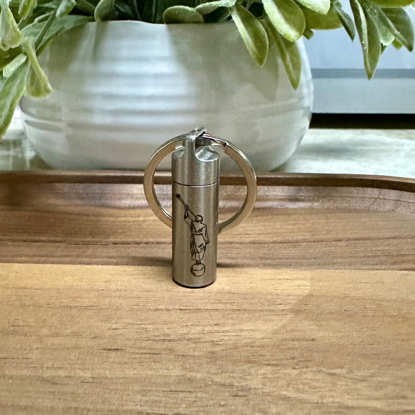 Small consecrated oil vial made of stainless steel with a secure screw cap, featuring an elegant engraved design, ideal for Latter-day Saint priesthood blessings