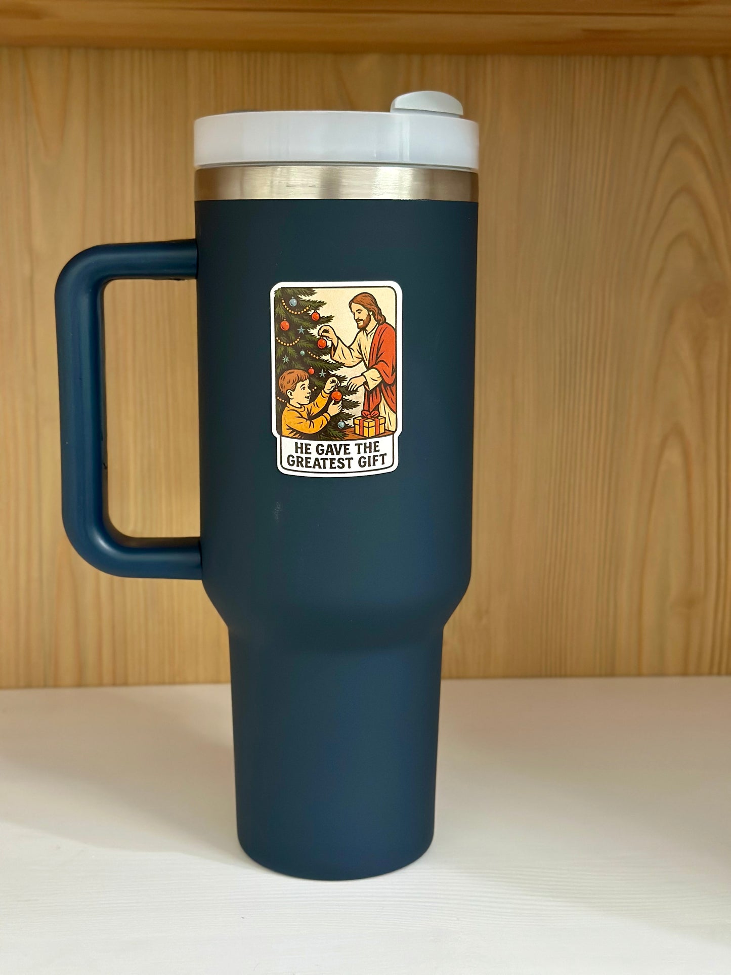 Jesus sticker on a blue cup