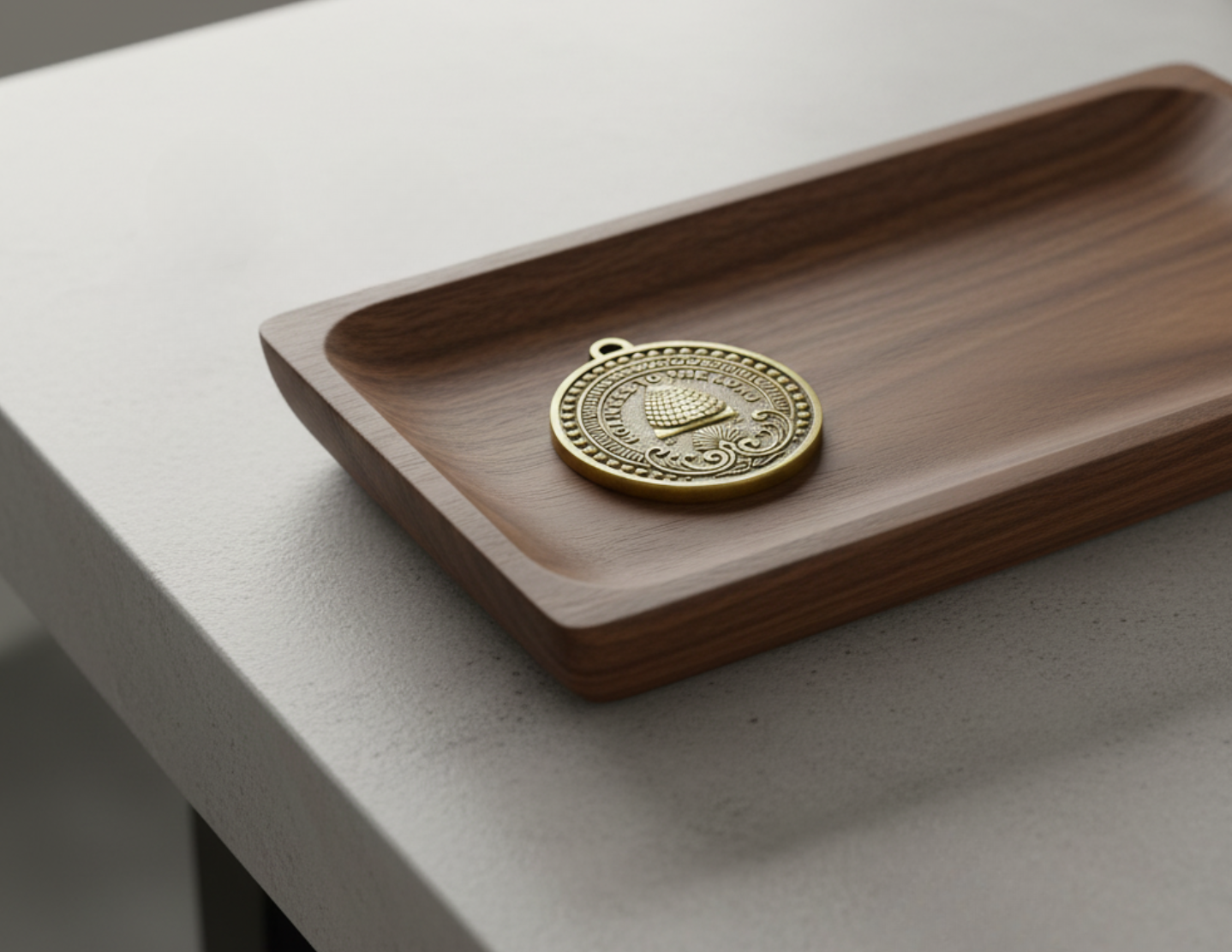 Wooden tray with a gold coin on a light gray surface, Mormon keychain medallion 