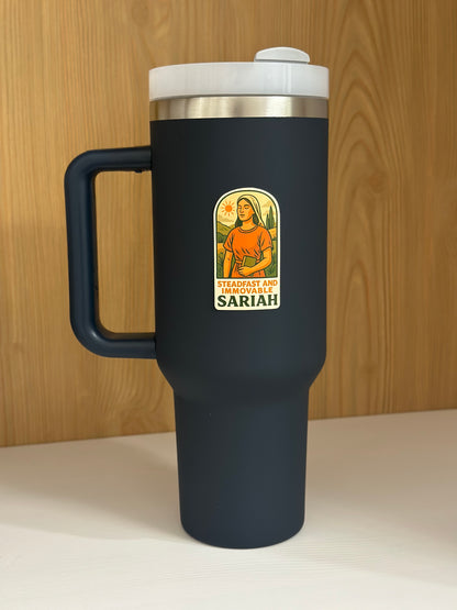 LDS sticker showing Sariah a book of mormon heroine , the sticker is on a navy blue tumbler. 