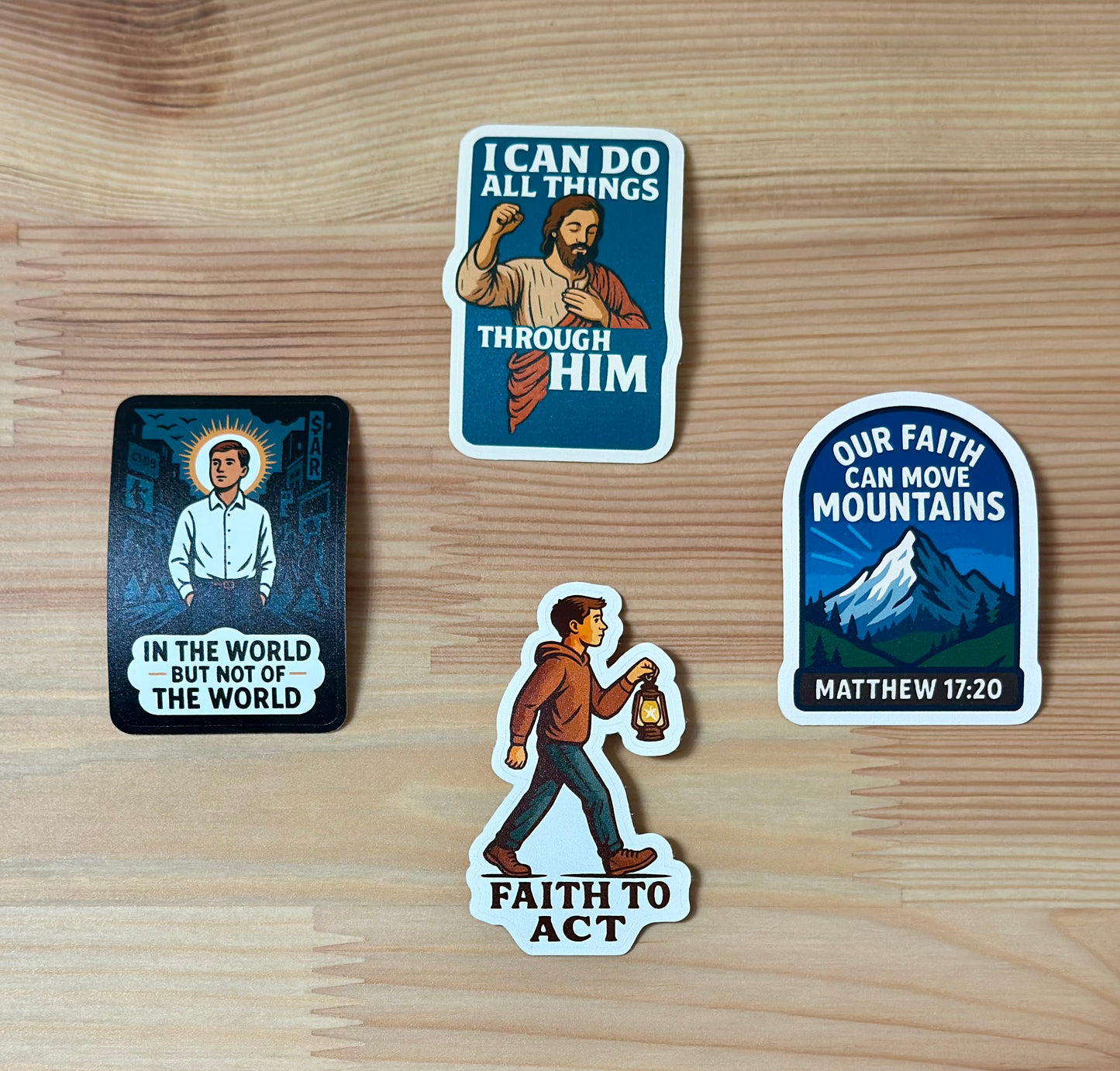 Four motivational stickers on a wooden surface